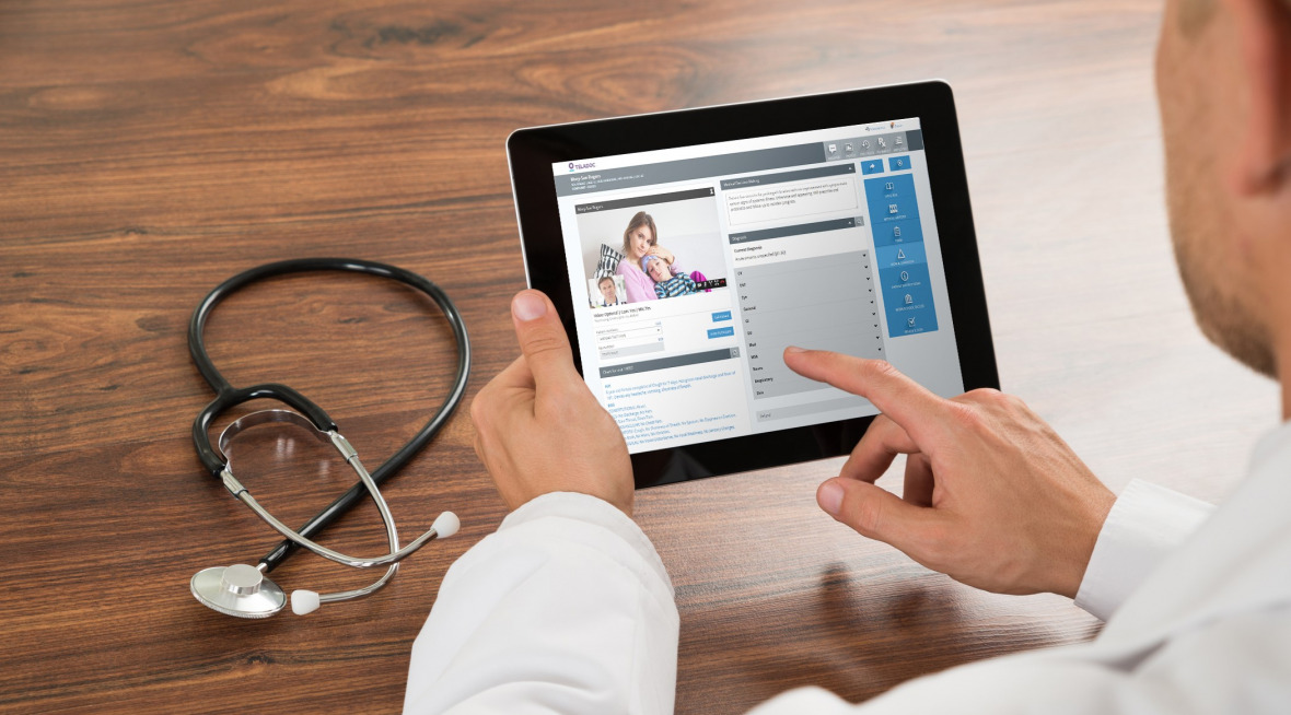 Doctor using tablet to communicate with patient virtual
