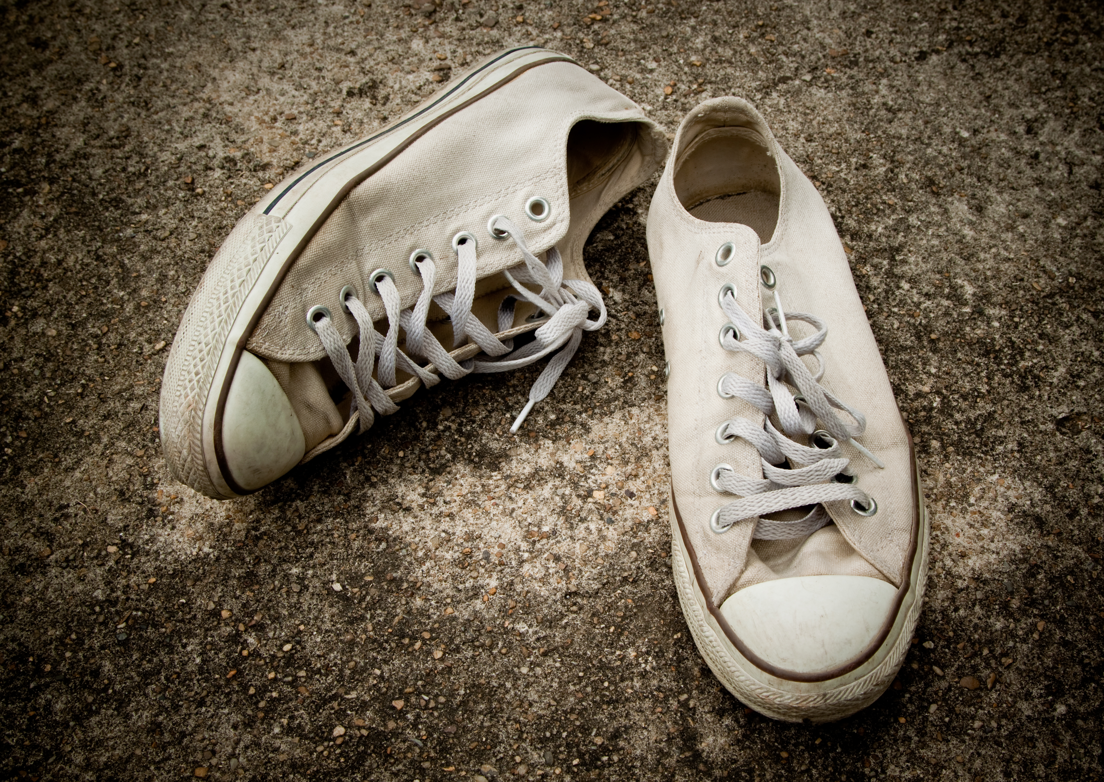 pair of older white converse sneakers