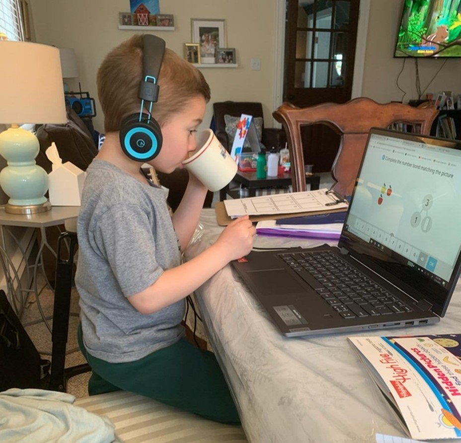 child-headphones-playing-game-laptop