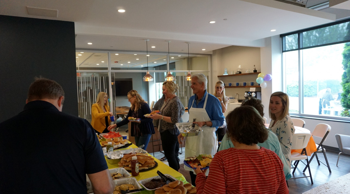 employees gathering over food for employee appreciation day