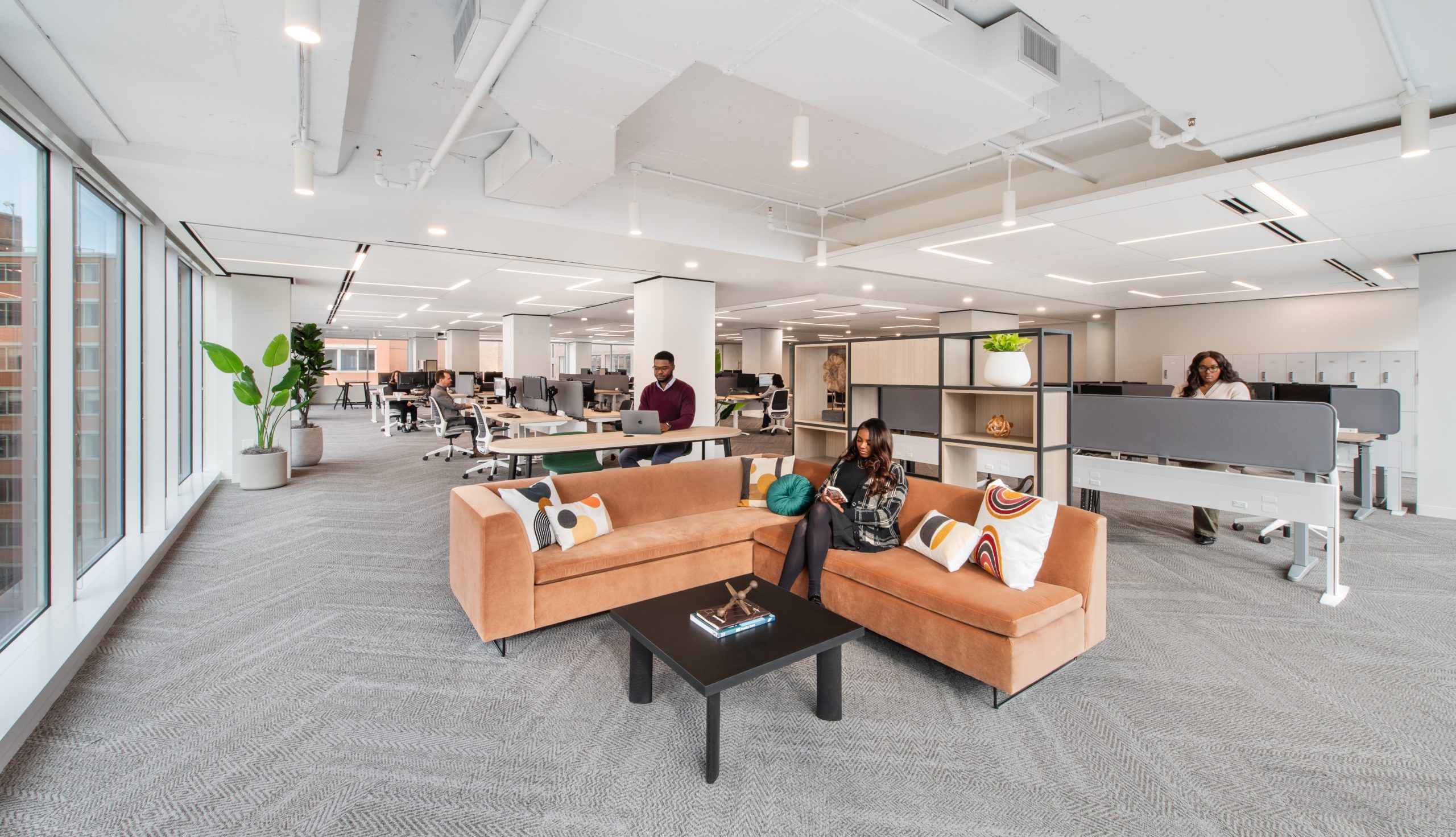team members enjoy new space after office relocation