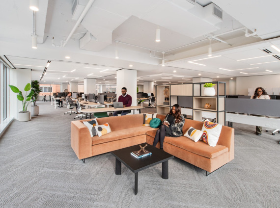 team members enjoy new space after office relocation