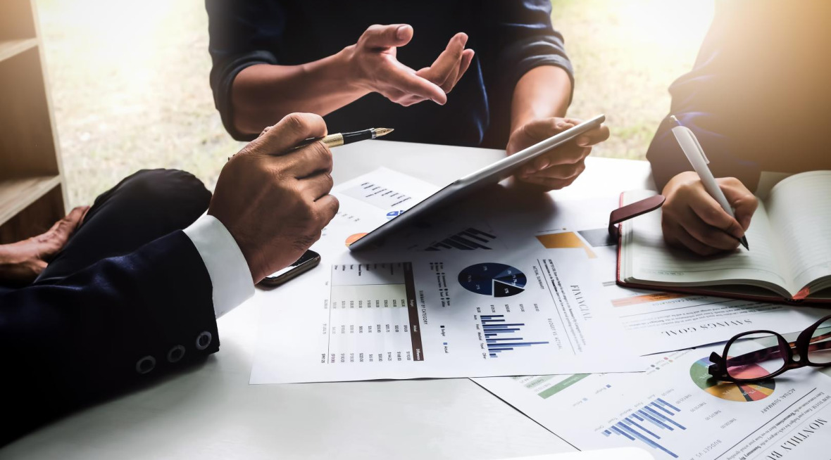 Team members set a budget and plan for move