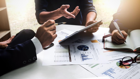 Team members set a budget and plan for move